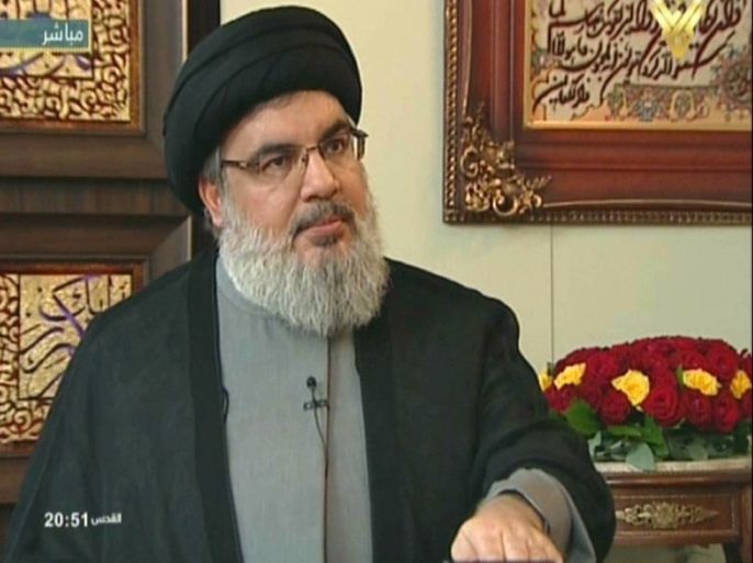 ALM67 - -, -, LEBANON : An image grab taken from Hezbollah's al-Manar TV on September 25, 2015 shows Hassan Nasrallah, the head of Lebanon's militant Shiite Muslim movement Hezbollah, answering questions from al-Manar's journalist during an interview at an undisclosed location in Lebanon. AFP PHOTO / AL-MANAR