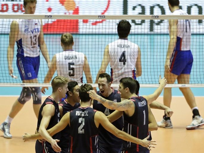US players (front) celebrate a point during the third round match between the USA and Russia at the FIVB Volleyball Men's World Cup in Tokyo, Japan, 22 September 2015.