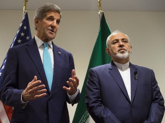 US Secretary of State John Kerry, left, speaks during a meeting with Iranian Foreign Minister Mohammad Javad Zarif at United Nations headquarters Saturday, Sept. 26, 2015. (AP Photo/Craig Ruttle)