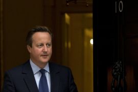 British Prime Minister David Cameron walks out to meet Danish Prime Minister Lars Loekke Rasmussen for their meeting at 10 Downing Street, London, Monday, Sept. 21, 2015. (AP Photo/Matt Dunham)