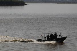 A Peruvian Navy boat patrol the Amazon river before a presidential meeting in Iquitos, September 30, 2014. Presidents Ollanta Humala and Juan Manuel Santos are attending the First Peru-Colombia Presidential and Ministerial Meeting in a military base on the Amazon forrest. REUTERS/Enrique Castro-Mendivil (PERU - Tags: POLITICS)