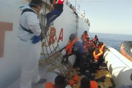 A handout photoreleased by the Italian Coast Guard (Guardia Costiere) on 20 September 2015 is a still grab from a video taken during an operation in the Mediterranean Sea as the Coast Guard in which they rescue 130 migrants at sea on 19 September 2015. Media reports say that around 4,700 migrants were rescued in different operation on Mediterranean Sea on Saturday, 19 September 2015. (ATTENTION EDITORS: Editorial use only in connection with reporting on the events depicted in the image) EPA/GUARDIA COSTIERA/HANDOUT