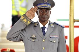 A photograph made available 19 September 2015 shows the new head of the country following a coup, General Gilbert Diendere saluting a guard of honour in Ouagadougou, Burkina Faso, 18 September 2015. Protests continue in Ouagadougou after Presidential guard officers seized power in a coup. The military council that has taken power in Burkina Faso released President Michel Kafando on 18 September, the radio station Omega FM reported, after strong international pressure was brought for the release. The junta also released two ministers who were detained with Kafando by the presidential guard on Wednesday, although Kafando was being held under house arrest. A statement issued by the coup leaders said the country would be led by General Gilbert Diendere who was former president Blaise Compaore's chief-of-staff.