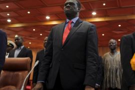 Burkina Faso President Michel Kafando (C) attends a ceremony marking the return of the transitional government in Ouagadougou, Burkina Faso, September 23, 2015. REUTERS/Joe Penney