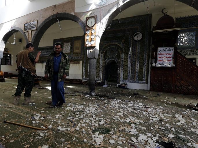 Yemenis inspect the scene of a suicide attack inside a mosque during prayers for the Muslim holiday of Eid al-Adha in Sanaa, Yemen, 24 September 2015. According to reports, at least 25 people were killed and dozens more wounded in the Yemeni capital Sana'a when a suicide bomber detonated an explosives belt inside a mosque during prayers for the Muslim holiday of Eid al-Adha.