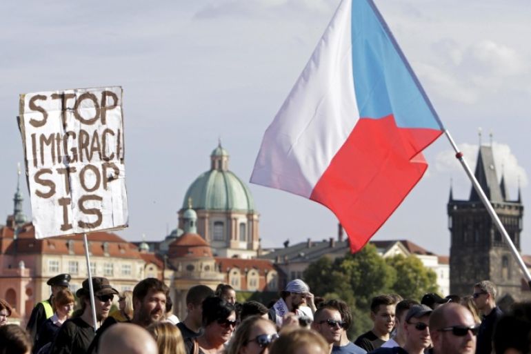 Demonstrators march during an anti-immigrants rally in Prague, Czech Republic, September 12, 2015. The banner reads: "Stop immigration, stop IS". REUTERS/David W Cerny
