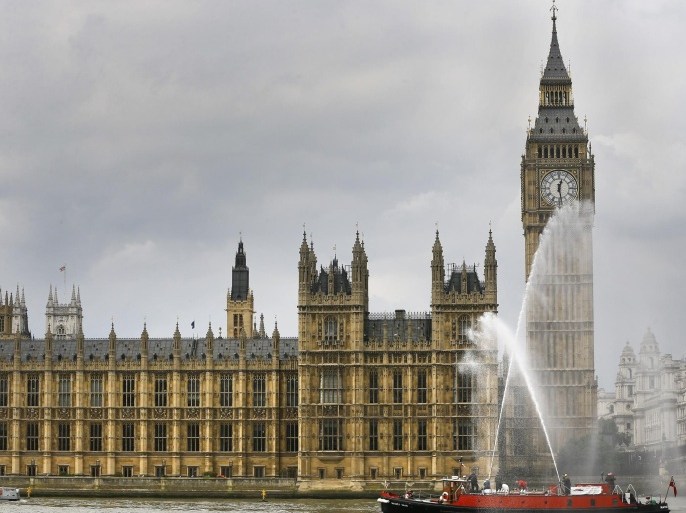 A Royal River Salute of boats passes the Houses of Parliament, to mark Britain's Queen Elizabeth II becoming the longest reigning monarch in British history, in London, Wednesday, Sept. 9, 2015. The Queen has on Wednesday become the longest ever reigning monarch in British history surpassing Queen Victoria who served for 63 years and seven months. (AP Photo/Kirsty Wigglesworth)
