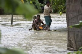 Indian villagers use a makeshift banana raft to cross floodwaters as they try to reach safer areas at Gagolmari village 85 kilometers (53 miles) east of Gauhati, India, Wednesday, Sept. 2, 2015. Monsoon floods have inundated hundreds of villages across the northeast Indian state of Assam, killing at several people and forcing some 800,000 people to leave their homes. (AP Photo/Anupam Nath)