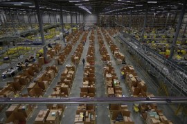HEMEL HEMPSTEAD, ENGLAND - DECEMBER 05: Parcels are prepared for dispatch at Amazon's warehouse on December 5, 2014 in Hemel Hempstead, England. In the lead up to Christmas, Amazon is experiencing the busiest time of the year.