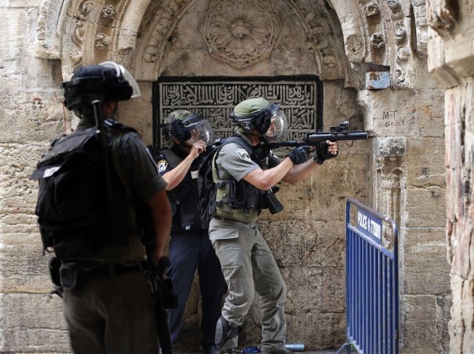 Israeli police use stun grenades to disperse Palestinian demonstrators in a street of the Muslim quarter in Jerusalem's Old City during scuffles with Israeli riot police on September 15, 2015. Muslims and Israeli police clashed at Jerusalem's flashpoint Al-Aqsa mosque compound for a third straight day as Jews celebrated their new year and protesters vowed to protect Islam's third-holiest site. AFP PHOTO
