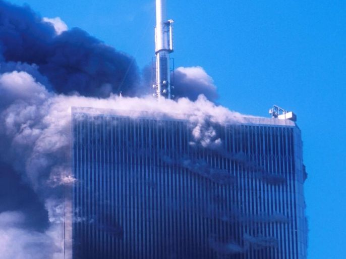 394273 01: Smoke billows from one of the World Trade Center's twin towers after it was struck by a commerical airliner in a suspected terrorist attack September 11, 2001 in New York City.