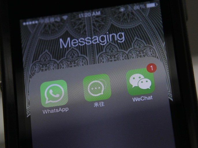 Icons of messaging applications WhatsApp of Facebook (L), Laiwang of Alibaba Group (C) and WeChat, or Weixin of Tencent Group, are seen on the screen of a smart phone on this file photo illustration taken in Beijing on February 24, 2014. Tens of millions of mobile game enthusiasts have made China Apple's third-largest market for software sales, and a huge chunk of that comes through WeChat. Known locally as Weixin, WeChat had 438 million monthly active users globally, mostly in China, at the end of June 2014, and has rapidly evolved from a messaging tool into a digital Swiss Army knife, allowing users to send messages, play games, book taxis and shop online. The app has proved a winning formula in getting people in China, a market notorious for not paying for software, to connect their bank accounts with their phones and pay for virtual goods like extra lives and power-ups in mobile games. To match story APPLE-CHINA/SOFTWARE REUTERS/Barry Huang/Files (CHINA - Tags: BUSINESS TELECOMS LOGO ENTERTAINMENT)