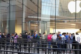 BEIJING, CHINA - OCTOBER 17: Chinese consumers line up to buy the iPhone6 and iPhone6 Plus outside an Apple store on October 17, 2014 in Beijing, China. Apple Inc began delivering its popular smartphone iPhone6 and iPhone6 Plus to the Chinese mainland on Friday.
