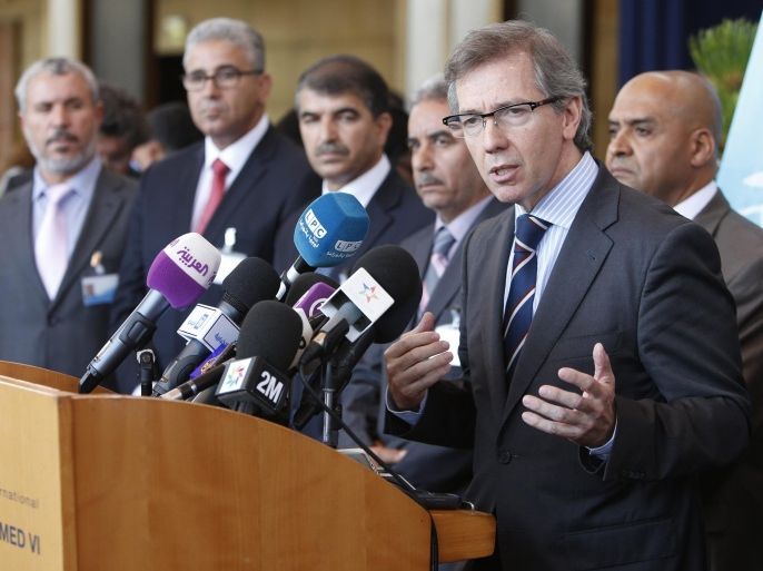 U.N. representative for Libya, Bernardino Leon, right, addresses reporters while Libyan parliaments members listen in Rabat, Morocco, Friday, Sept. 18, 2015. Rival Libyan sides are supposed to agree on a unity government for the divided North African nation. (AP Photo/Abdeljalil Bounhar)