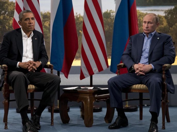 FILE - President Barack Obama meets with Russian President Vladimir Putin in Enniskillen, Northern Ireland, Monday, June 17, 2013. Vladimir Putin's spokesman said Thursday Sept. 24, 2015, that the Russian president will meet with President Barack Obama on Monday. Putin is to speak to the United Nations General Assembly that day. It's not clear whether the meeting with Obama will take place before or after the speech. (AP Photo/Evan Vucci, File)