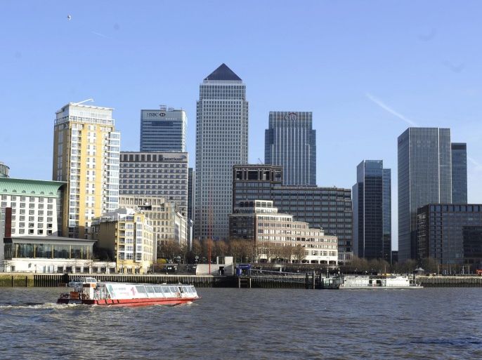 (FILE) A file photo dated 31 January 2013 shoqing a boat passing by Canary Wharf, part of London's financial district, in London, Britain. Top EU officials agreed in principle to limit bankers' bonuses to one year's basic salary, in what they called 28 March 2013 the bloc's most far-reaching bank regulations yet. The move aims to prevent a repeat of the 2008 global financial crisis and bring the EU in line with new rules for the financial services sector known as Basel III. The bonus cap should discourage bankers from taking excessive risks for short-term gain, said Michael Noonan, finance minister of Ireland, which holds the bloc's rotating presidency. The limit could only be exceeded by special permission - for example with the approval of a majority of shareholders - to no more than two years' salary, Noonan said.