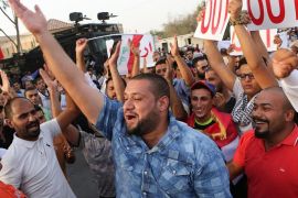 Protesters chant slogans during a demonstration against corruption in Basra, 340 miles (550 kilometers) southeast of Baghdad, Iraq, Friday, Sept. 4, 2015. Iraq's top Shiite cleric said on Friday the government must start hunting the "big heads" as part of its anti-corruption drive, calling for "convincing and assuring steps" as proof of the government's seriousness in implementing its highly-touted reform plan. (AP Photo/Nabil al-Jurani)