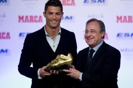 MADRID, SPAIN - NOVEMBER 05: Cristiano Ronaldo (L) of Real Madrid CF receives the Golden Boot award from president of Real Madrid CF Florentino Perez (R) at Melia Castilla hotel on November 5, 2014 in Madrid, Spain. Cristiano Ronaldo's 31 strikes in La Liga last season have given him his third Golden Boot award. This year he has shared the award with FC Barcelona player Luis Suarez for the best scorer in Europe. Both players have scored the same number of goals thorough 2013-2014 season.