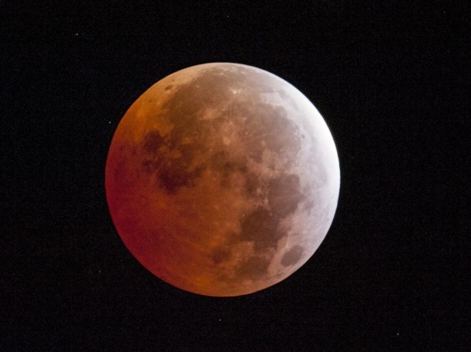 A lunar eclipse is seen on Saturday, April 4, 2015, in Placerville, Calif. Early risers in the western U.S. and Canada should have been able to catch a glimpse before dawn Saturday. The moment when the moon was completely obscured by Earth's shadow lasted only a few minutes, making it the shortest lunar eclipse of the century. (AP Photo/The Sacramento Bee, Randall Benton)