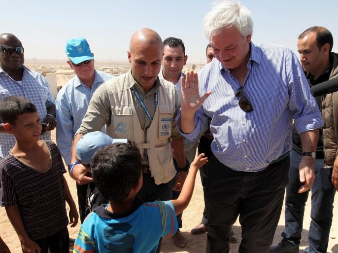 United Nations Under-Secretary-General for Humanitarian Affairs and Emergency Relief Coordinator, Stephen O'Brien (2-R) greets a Syrian refugee boy at Syrian Zattari refugee camp, near Mafraq city, Jordan, 19 September 2015. Since the beginning of the Syrian conflict, 250,000 people have been killed and 1 million Syrians have been injured. Some 7.6 million people have been internally displaced, including more than 1 million people this year alone, while more than 4 million Syrians have fled the country.