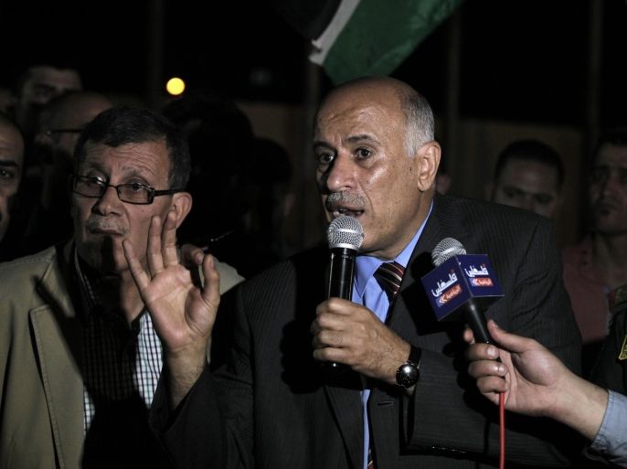 President of the Palestinian FA Jibril Rajoub (C) speaks to the press upon his arrival in the West Bank city of Jericho on June 1, 2015, following the FIFA presidential race. Palestine, which has been a FIFA member since 1998, had wanted the governing body to expel Israel over its restrictions on the movement of Palestinian players, yet Rajoub withdrew his association's bid. AFP PHOTO / AHMAD GHARABLI