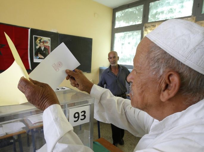 A Moroccan man casts his ballot in a polling station for municipal elections in Casablanca, Morocco, Friday Sept. 4, 2015. Moroccans are voting in regional and communal elections, the first since the central government gave its regions greater autonomy. (AP Photo/Abdeljalil Bounhar)