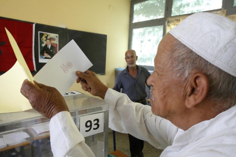 A Moroccan man casts his ballot in a polling station for municipal elections in Casablanca, Morocco, Friday Sept. 4, 2015. Moroccans are voting in regional and communal elections, the first since the central government gave its regions greater autonomy. (AP Photo/Abdeljalil Bounhar)