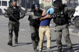 Israeli border policemen detain a Palestinian protester during clashes in Shuafat refugee camp near Jerusalem September 18, 2015. Israel deployed hundreds of extra police around the Old City of Jerusalem on Friday after Palestinian leaders called for a 'day of rage' to protest at new Israeli security measures. In an effort to limit the threat of violence, Israel also banned access to al-Aqsa for all men under 40 on Friday, the Muslim holy day. REUTERS/Ammar Awad