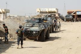 In this Thursday, Aug. 27, 2015 photo, Iraqi security forces, backed by Sunni and Shiite volunteers clash with Islamic State group militants at the front line in the eastern suburbs of Ramadi, Anbar province, Iraq. (AP Photo)