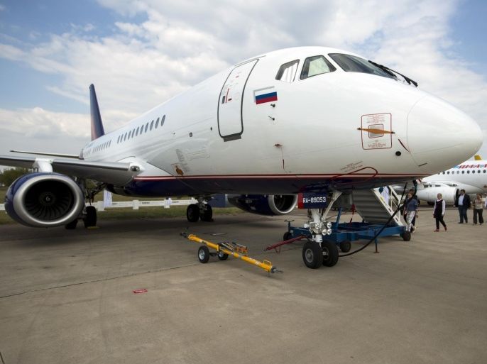 People queue to enter a Sukhoi Superjet 100 during the MAKS-2015 International Aviation and Space Show in Zhukovsky, outside Moscow, Russia, Wednesday, Aug. 26, 2015. The XII International Aviation and Space Show in Zhukovsky opened yesterday for specialists and press, with members of the public invited to visit it from Friday, Aug. 28. (AP Photo/Pavel Golovkin)