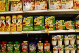 Gerber® Graduates® Grabbers™squeezable fruit or fruit/vegetable pouches made with natural fruits and vegetables sit on the shelf next to other baby food products in the baby food aisle in City Target on Thursday, Jan. 3, 2013, in downtown Los Angeles. Though they can be more expensive, pouches are beloved by parents who can let their kids feed themselves at a young age. (AP Photo/Nick Ut)