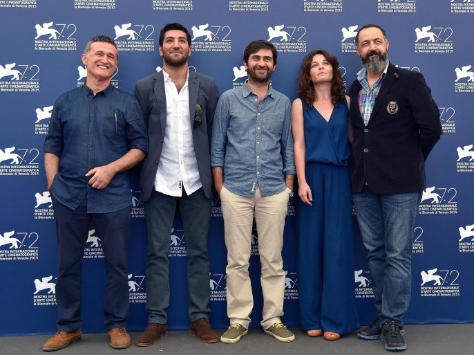 (L-R) Actors/cast members Mufit Kayacan, Berkay Ates, Turkish director Emin Alper, actors/cast members Tulin Ozen and Mehmet Ozgur pose during a photocall for the movie 'Abluka (Frenzy)' at the 72nd annual Venice International Film Festival, in Venice, Italy, 08 September 2015. The movie is presented in official competition 'Venezia 72' at the festival running from 02 September to 12 September.
