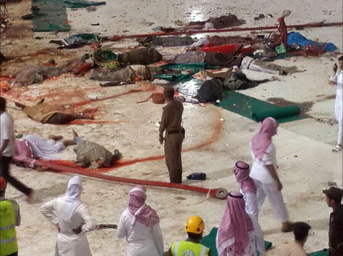 epa04925732 A general view from inside the Grand Mosque in Mecca, Saudi Arabia, showing bodies laying scattered on the floor after a large crane collapsed on the mosque on 11 September 2015. The civil defense authority of Saudi Arabia has confirmed at least 52 casualties with some 30 people injured in the accident. EPA/STRINGER ATTENTION EDITORS: GRAPHIC CONTENT