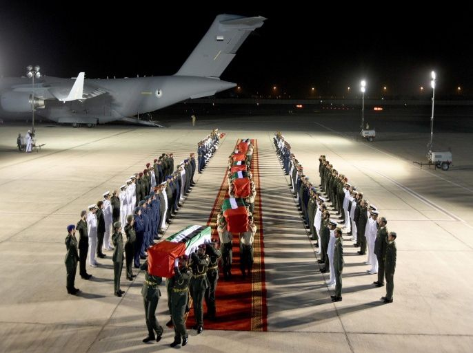A handout picture released by Emirates News Agency (WAM) shows Emirati soldiers carrying coffins of some of the UAE soldiers who died during the military operation 'Operation Restore Hope' under the Saudi Arabia-led Arab alliance in Yemen during the funeral ceremony at Al Bateen Airport in Abu Dhabi, United Arab Emirates, 05 September 2015. Forty-five Emirati troops were killed 04 September in an apparent missile strike in eastern Yemen, the heaviest losses yet for an alliance of Gulf states who have joined the fight against Iran-backed Houthi rebels. The incident marks the greatest loss of life in the history the Gulf state's armed forces - as well as the clearest indication yet of the key role its troops are playing in the fight against the rebels inside Yemen. EPA/EMIRATES NEWS AGENCY / HANDOUT