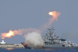 A Russian warship fires during celebrations for Navy Day in the Black Sea port of Sevastopol, Crimea, July 26, 2015. REUTERS/Pavel Rebrov