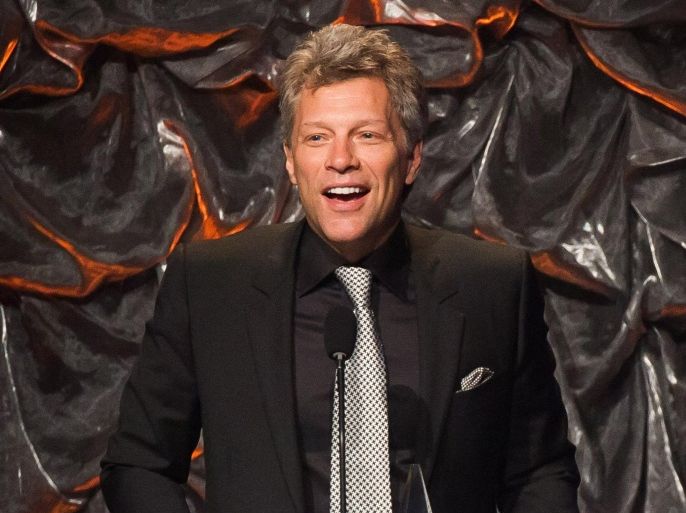 FILE - In this June 12, 2014 file photo, Jon Bon Jovi attends the Songwriters Hall of Fame Awards in New York. Bon Jovi has joined forces with Paul McCartney, Sheryl Crow and Fergie to record a song about climate change. Sean Paul, Leona Lewis and Colbie Caillat also appear on “Love Song to the Earth,” which was released Friday, Sept. 4 on iTunes and Apple Music via Connect. (Photo by Charles Sykes/Invision/AP, File)
