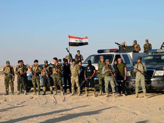 Sunni volunteer tribal fighters deploy as they support the Iraqi security forces in liberating the city of Ramadi, Iraq, from Islamic State group militants, in the eastern suburbs of Ramadi, the capital of Iraq's Anbar province, 70 miles (115 kilometers) west of Baghdad, Sunday, Oct. 11, 2015. (AP Photo)