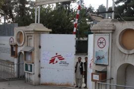 Afghan guards stand at the gate of Medecins Sans Frontieres (MSF) hospital after an air strike in the city of Kunduz, Afghanistan October 3, 2015. A U.S air strike may have hit a hospital run by MSF, a NATO forces spokesman said, after the medical aid group blamed an aerial attack for the destruction in the northern Afghan city of Kunduz that killed three staff. REUTERS/Stringer
