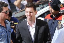 Barcelona F.C. star Lionel Messi arrives at a court to answer questions in a tax fraud case in Gava, near Barcelona, Spain, Friday, Sept. 27, 2013. Lionel Messi and his father were ordered by the Spanish court to appear for questioning on Friday as part of an investigation into tax fraud allegations. The court in the Mediterranean coastal town of Gava near Barcelona accepted a state prosecutor's complaint alleging that Messi and father Jorge defrauded the Spanish tax office of 4 million euros ($5.3 million). (AP Photo/Emilio Morenatti)
