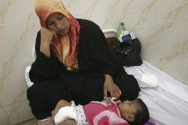 An Iraqi woman comforts her child, who health officials suspect is infected with cholera, at a hospital in Hashimiyah, 80 kilometers (50 miles) south of Baghdad, Iraq on Wednesday, Sept. 10, 2008. Iraqi officials say the number of people killed by a cholera outbreak in Iraq has risen to two and that the waterborne disease has infected at least 90 people.