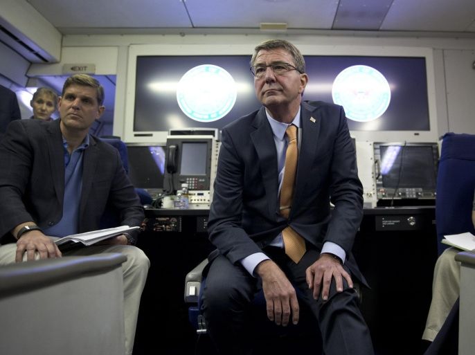U.S. Defense Secretary Ash Carter, joined by U.S. Department of Defense press secretary Peter Cook, left, and Col. Steve Warren, right, pauses to listen to a media question during a news conference on a military aircraft, Sunday, July 19, 2015, en route to Tel Aviv, Israel, from Andrews Air Force Base, MD. Carter is traveling to Israel to talk with officials there as well as Jordan and Saudi Arabia, U.S. allies whose leaders also are worried about the Iran nuclear deal's implications. (AP Photo/Carolyn Kaster, Pool)