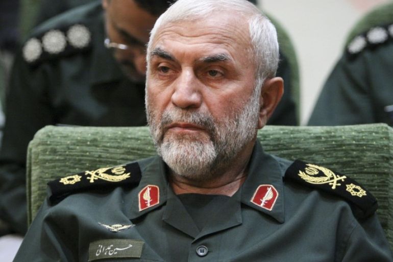 In this Dec. 9, 2009 photo, released by Iranian Tasnim News Agency, Iranian Revolutionary Guard Gen. Hossein Hamedani sits in a meeting in Tehran, Iran. Hamedani, a senior commander in Iran's powerful Revolutionary Guard was killed by Islamic State extremists on the outskirts of the northern Syrian city of Aleppo, Iranian state media reported on Friday. A state television report said that Gen. Hossein Hamedani was killed in the suburbs of Aleppo while "carrying out an advisory mission." (AP Photo/Tasnim News Agency, Hamed Malekpour)