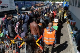 Refugees wait to cross the Austrian-German border near Freilassing, Germany, 30 September 2015. Some 522,000 migrants have made the dangerous crossing across the Mediterranean so far this year, the International Organization for Migration (IOM) reported in Geneva.