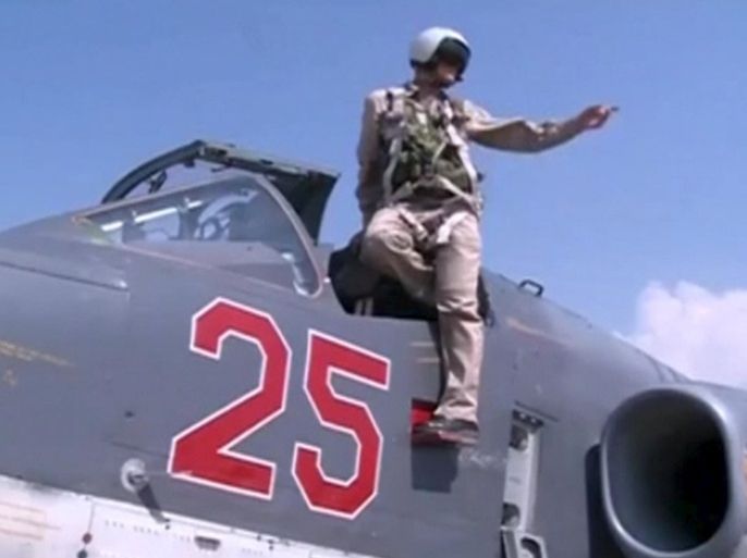 A frame grab taken from footage released by Russia's Defence Ministry October 5, 2015, shows a pilot gesturing from a Russian air force Su-25 military jet on the tarmac of Heymim air base in Syria. More than 40 Syrian insurgent groups including the powerful Islamist faction Ahrar al-Sham have called on regional states to forge an alliance against Russia and Iran in Syria, accusing Moscow of occupying the country and targeting civilians. REUTERS/Ministry of Defence of the Russian Federation/Handout via Reuters ATTENTION EDITORS - FOR EDITORIAL USE ONLY. NOT FOR SALE FOR MARKETING OR ADVERTISING CAMPAIGNS. THIS IMAGE HAS BEEN SUPPLIED BY A THIRD PARTY. IT IS DISTRIBUTED, EXACTLY AS RECEIVED BY REUTERS, AS A SERVICE TO CLIENTS. REUTERS IS UNABLE TO INDEPENDENTLY VERIFY THE AUTHENTICITY, CONTENT, LOCATION OR DATE OF THIS IMAGE. FOR EDITORIAL USE ONLY. NO SALES.