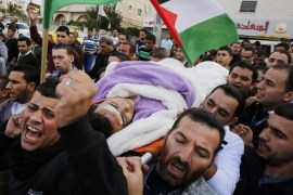 Palestinians carrying the body of 17-years old Mohammad Jabari during his funeral in the West Bank city of Hebron, 10 October 2015. Jabari was shot dead after stabbing an Israeli police officer in Kiryat Arba, a settlement near Hebron, on 09 October. Violence has been ongoing for weeks, focused on Jerusalem and nearby areas on the West Bank amid rising concerns the situation could lead to an even greater escalation if not scaled back soon.