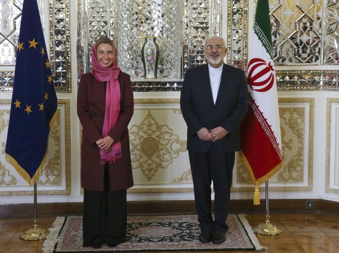 Iranian Foreign Minister Mohammad Javad Zarif, right, and European Union foreign policy chief Federica Mogherini pose for media prior to a round of talks, in Tehran, Iran, Tuesday, July 28, 2015. Iran's foreign minister says "high-level" talks will soon be launched with the European Union following a nuclear agreement reached with world powers earlier this month. (AP Photo/Vahid Salemi)