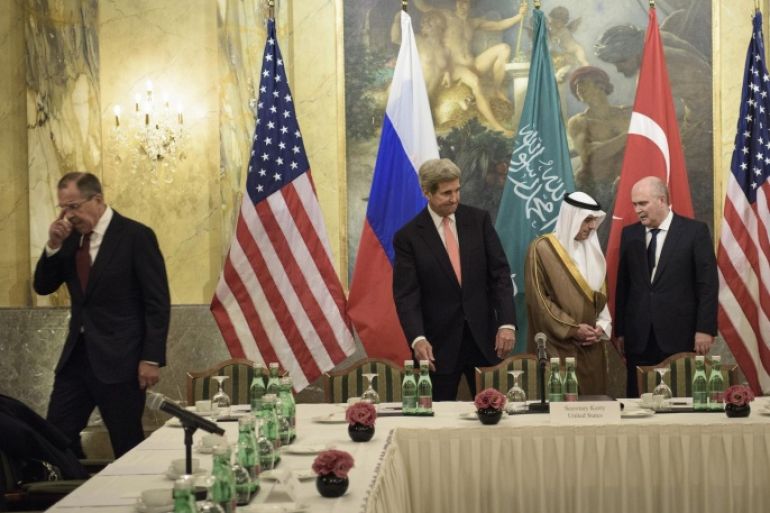 From left, Russian Foreign Minister Sergei Lavrov, Secretary of State John Kerry, Saudi Foreign Minister Adel al-Jubeir and Turkish Foreign Minister Feridun Sinirlioglu take their seats before a meeting in Vienna, Austria, Thursday, Oct. 29, 2015. Kerry and other leaders are in Vienna to discuss solutions to the conflict in Syria. (Brendan Smailowski/Pool via AP)