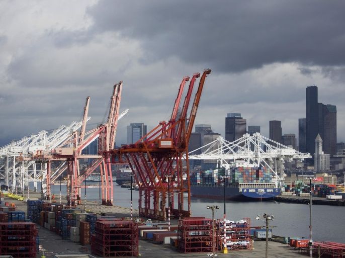 A cargo ship sits docked at the Port of Seattle in Seattle, Washington, U.S., on Tuesday, March 30, 2015. The U.S. Census Bureau is scheduled to release international trade balance figures on April 2.