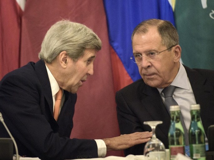 US Secretary of State John Kerry, left, and Russian Foreign Minister Sergey Lavrov share a word prior to the start of the Syria talks at a hotel in Vienna, Austria, Friday, Oct. 30, 2015. Kerry is acknowledging that progress will be difficult as he launches a marathon day of talks aimed at ending the Syrian War but is expressing some hope of headway. With 19 foreign ministers and other senior dignitaries attending, participants say the fact that the talks are happening despite deep divisions among key players are in themselves a sign of success. (Brendan Smialowski/Pool Photo via AP)