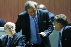 UEFA President Michel Platini (C) speaks with FIFA President Sepp Blatter (L) and Jerome Valcke, Secretary General of the FIFA, at the 65th FIFA Congress in Zurich, Switzerland, May 29, 2015. The embattled head of world soccer, FIFA President Sepp Blatter, is expected to be re-elected on Friday despite growing calls for his resignation amid a corruption scandal that has engulfed the sport's governing body. REUTERS/Ruben Sprich